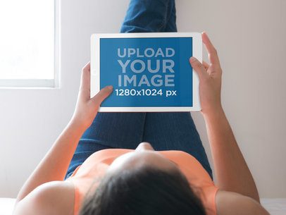Woman Laying in Bed With iPad Mockup Generator