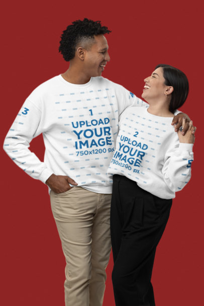 Gildan Sweatshirt Mockup of a Happy Couple Smiling at Each Other in a Studio