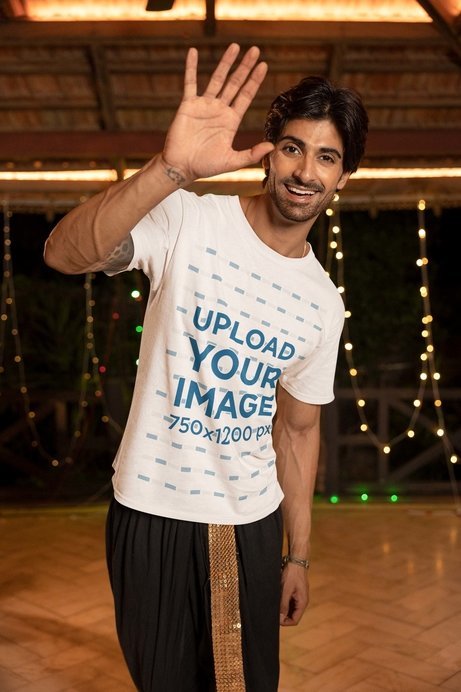 Gildan Round-Neck Tee Mockup Featuring a Cheerful Man Waving in a Diwali Celebration