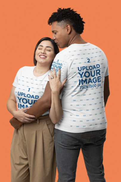 Bella Canvas T-Shirt Mockup Featuring a Smiling Man and Woman Hugging and Posing in a Studio