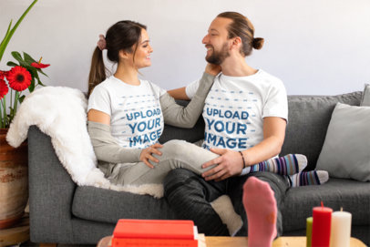 T-Shirt Mockup of a Sweet Couple Smiling on the Couch