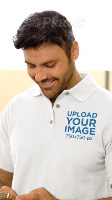 Gildan Polo Shirt Video of a Bearded Man Using a Smartphone
