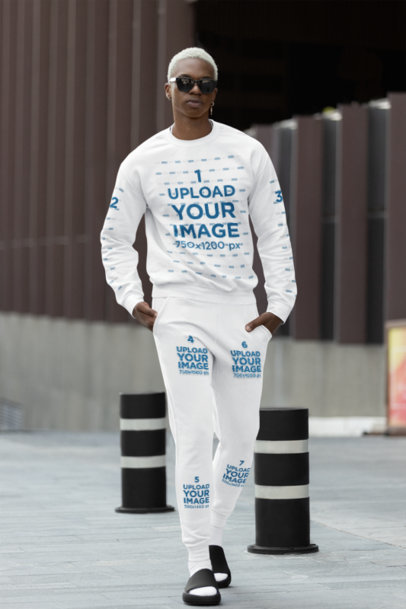 Gildan Sweatshirt Mockup Featuring a Man With Cotton Heritage Sweatpants Walking on the Street