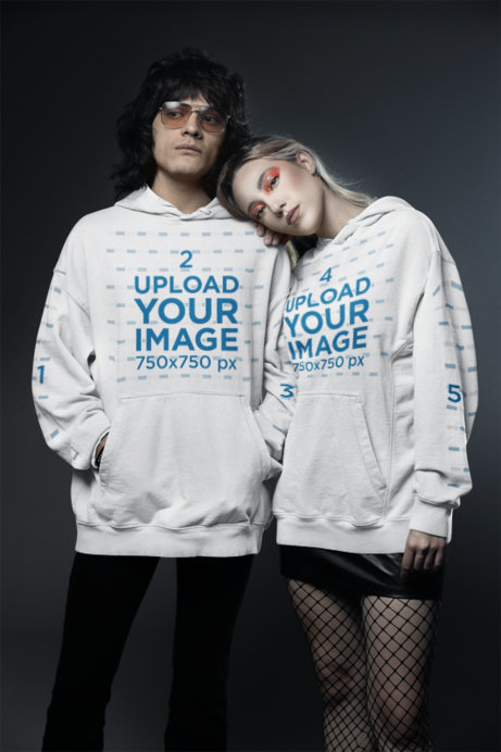 Gildan Pullover Hoodie Mockup Featuring a Couple with Glam Rock-Inspired Outfits