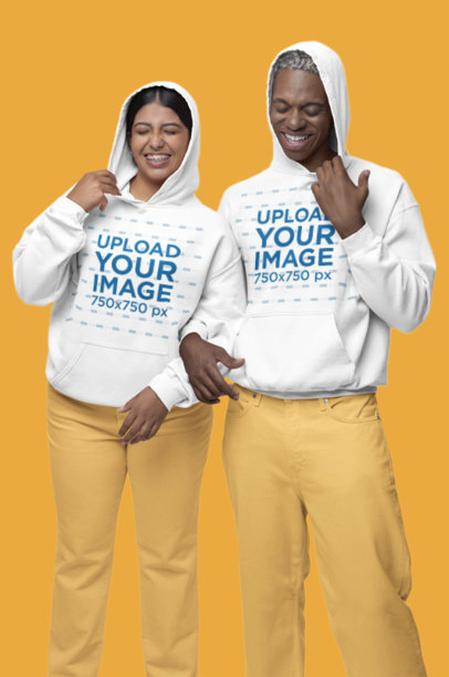 Gildan Hoodie Mockup of a happy Man and Woman Posing Against a Colorful Background