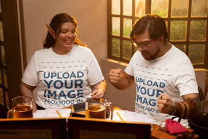 Bella Canvas T-Shirt Mockup Featuring an Excited Man Playing RPG With a Woman