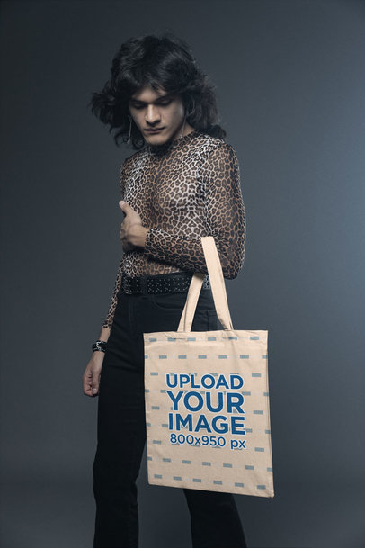 Glam Rock-Inspired Mockup Featuring a Long-Haired Man Carrying a Tote Bag