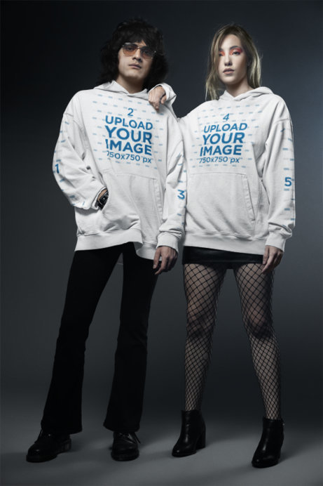 Gildan Hoodie Mockup of a Man and a Woman Posing With Rock Styles