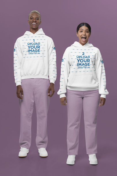 Gildan Pullover Hoodie Mockup of a Happy Man and Woman Posing Against a Colorful Background