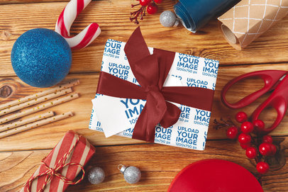 Wrapping Paper and Gift Card Mockup Featuring a Present and a Christmas Theme m35553 r-el2