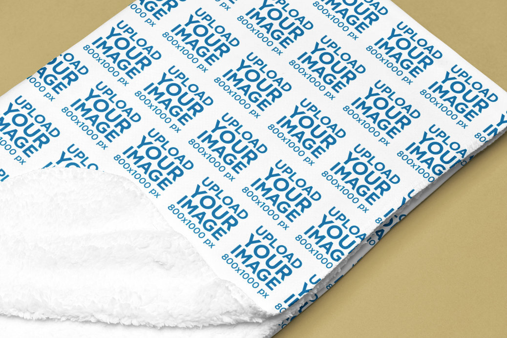 Mockup of a Folded Sherpa Fleece Blanket Lying on a Colorful Surface