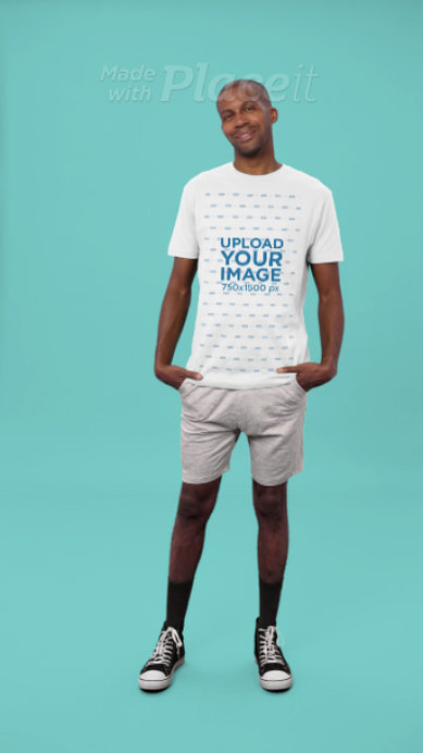 Next Level T-Shirt Video of a Smiling Posing in a Studio With a Colorful Background