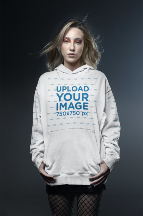 Glam Rock-Inspired Gildan Pullover Hoodie Mockup of a Woman Standing in a Studio
