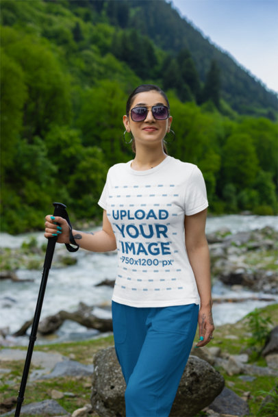 Gildan T-Shirt Mockup Featuring a Woman Hiking on a Mountain
