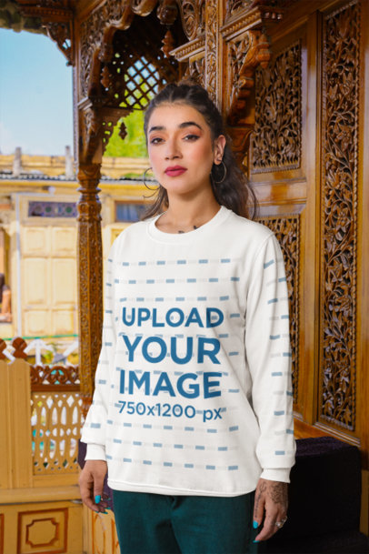 Mockup of a Woman Wearing a Rounded-Neck Sweatshirt in Front of a Wooden Wall m35576