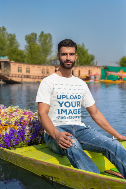Gildan T-Shirt Mockup of a Bearded Man on a Flower-Decorated Canoe m35556