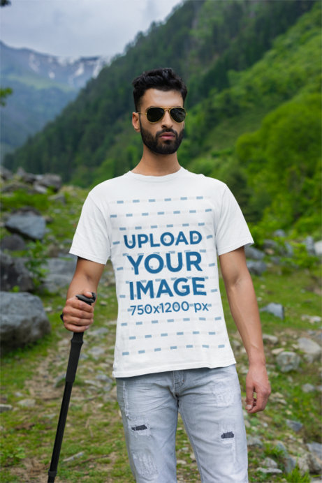 Round-Neck Tee Mockup of a Bearded Man Hiking on a Mountain