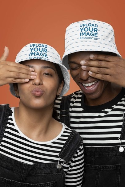 Gender-Neutral Mockup of a Man and Woman Wearing Bucket Hats m36583