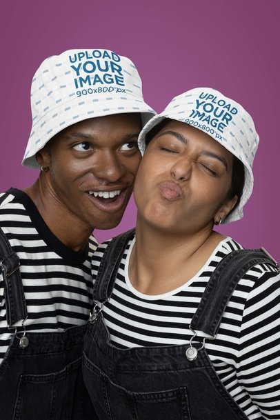 Bucket Hat Mockup of a Happy Man and Woman Making Funny Faces m36584