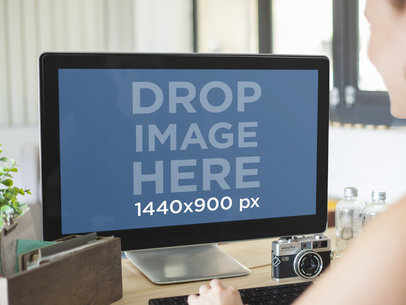 Young Woman Working on PC Desktop at Creative Office 