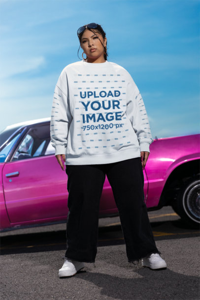 Oversized Sweatshirt Mockup of a Woman Posing Against a Car