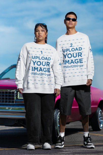 Oversized Sweatshirt Mockup Featuring a Latin Man and Woman Posing in the Street