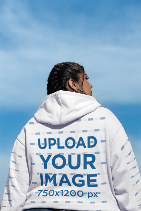 Back-View Hoodie Mockup of a Serious Latin Woman Posing Outdoors