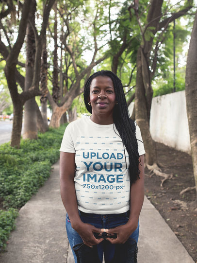T-Shirt Mockup Featuring a Woman with Small Braids on the Street 
