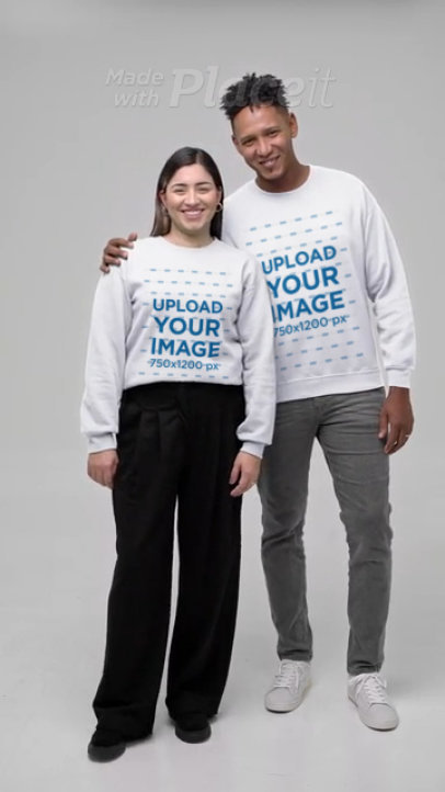 Gildan Sweatshirt Video Featuring a Smiling Man and a Woman Hugging in a Studio