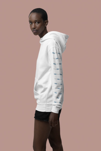 Mockup of a Woman Wearing a Cotton Heritage Hoodie with a Customizable Sleeve