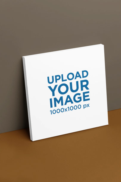 Mockup of a Canvas Frame Leaning Against a Customizable Wall