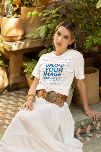 Bella Canvas T-Shirt Mockup of a Woman Posing by Plant Pots in a Boho-Style Outfit