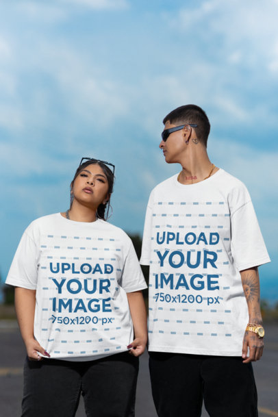 Mockup of a Man and a Woman Wearing Oversized Stanley Stella T-Shirts