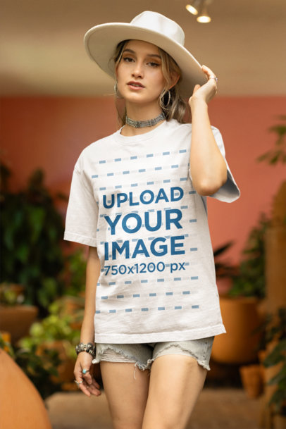 Mockup of a Woman in a Boho-Inspired Outfit Wearing an Oversized Stanley Stella Tee
