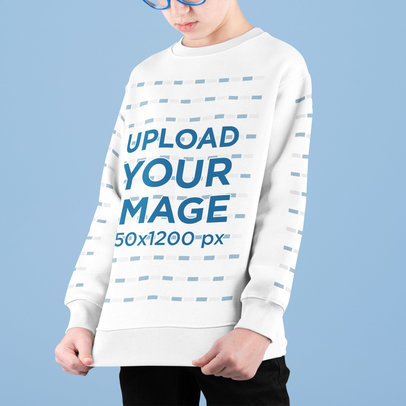 Sweatshirt Mockup Featuring a Cropped-Face Boy in a Studio