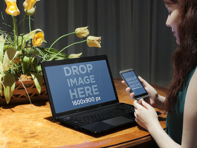 Woman Uses HTC and PC Laptop While Working at Dining Table