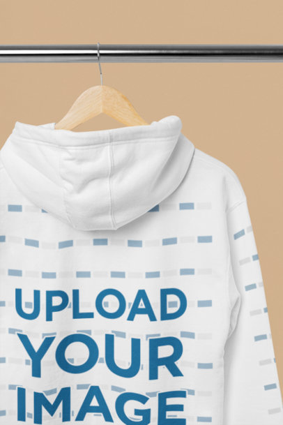 Mockup of a Cotton Heritage Pullover Hoodie Placed on a Hanger