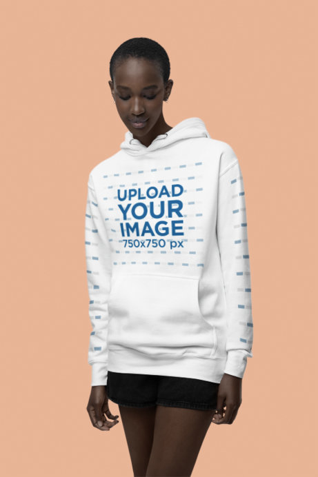 Mockup of a Short-Haired Woman Wearing a Cotton Heritage Hoodie in a Studio