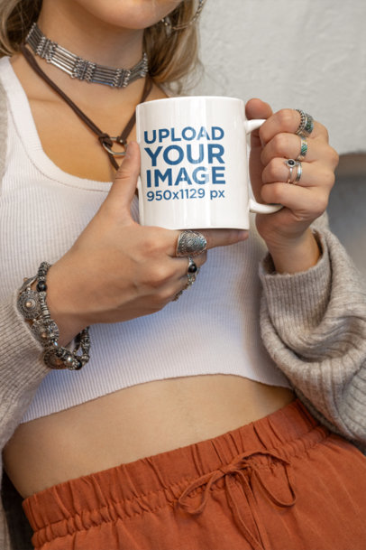 Mockup of a Woman in Boho Garments Holding an 11 oz Coffee Mug m36860