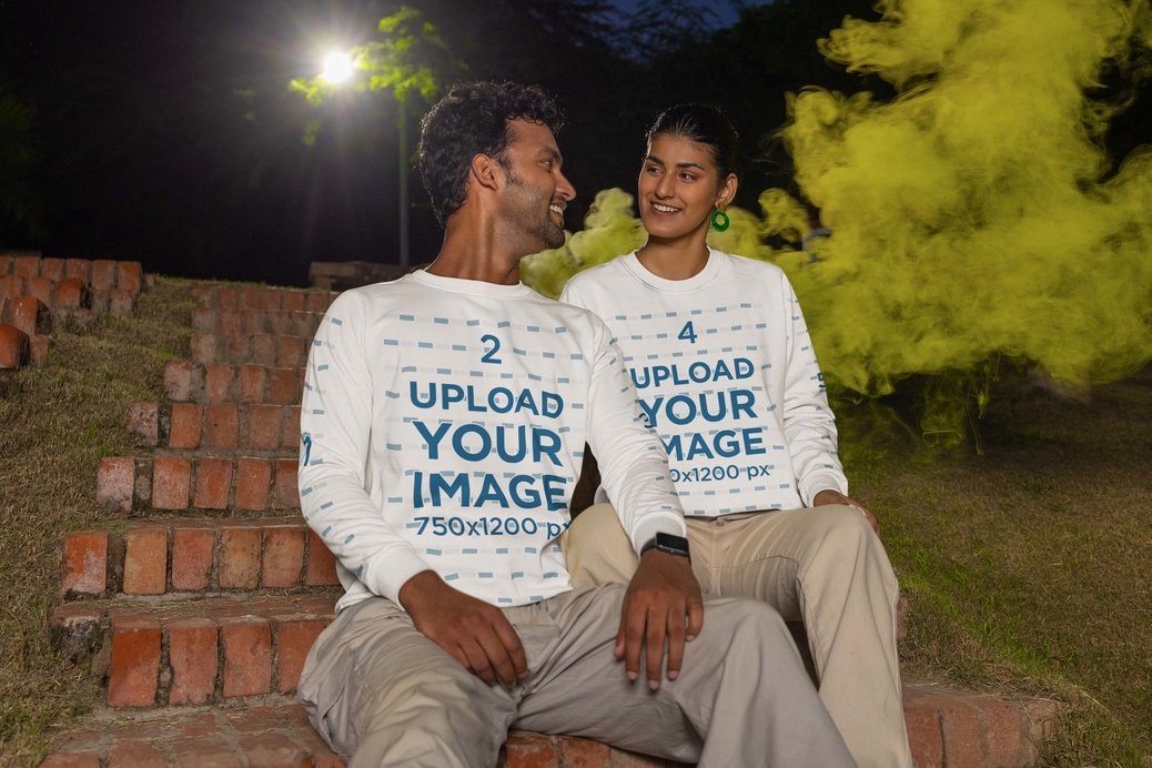 Sweatshirt Mockup of a Man and Woman Sitting on a Staircase With Happy Looks