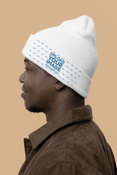 Side-View Yupoong Beanie Mockup Featuring a Man in a Studio m35470