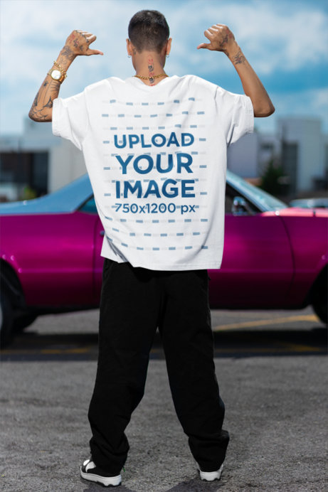 Back-View Mockup of a Man Pointing to His Oversized Stanley Stella T-Shirt
