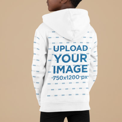 Back-View Hoodie Mockup Featuring a Boy Posing in a Studio