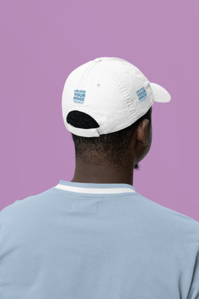 Back-View Dad Hat Mockup of a Man Standing in a Studio m35465