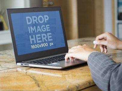 Laptop Mockup of Business Woman Using Asus Zenbook at Work