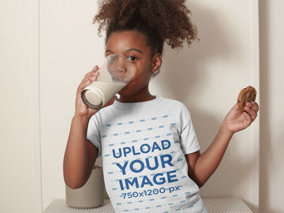 Mockup of a Black Girl with Curly Hair Drinking Milk Holding a Cookie