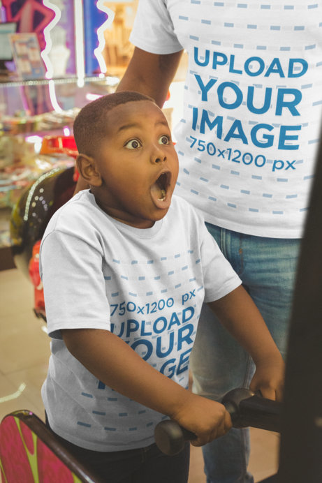 T-Shirt Mockup of an Excited Kid Playing at the Arcade with his Dad