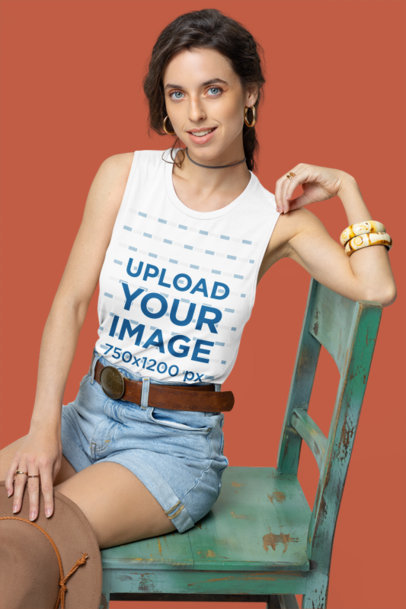 Bella Canvas Tank Top Mockup of a Happy Woman With a Boho Style Sitting on a Rustic Chair