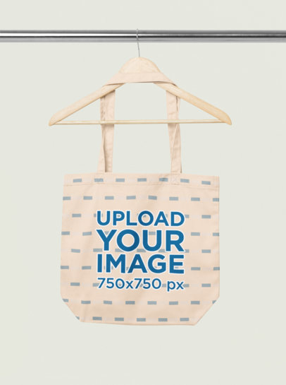 Mockup of an Econscious Tote Bag Placed on a Wooden Hanger