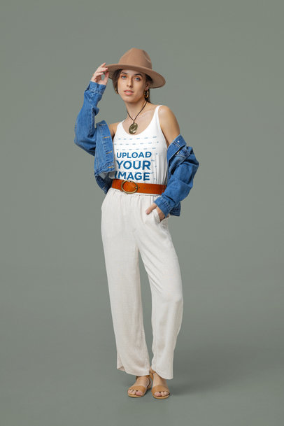 Boho-Inspired Mockup of a Woman Wearing a Bella Canvas Tank Top in a Studio
